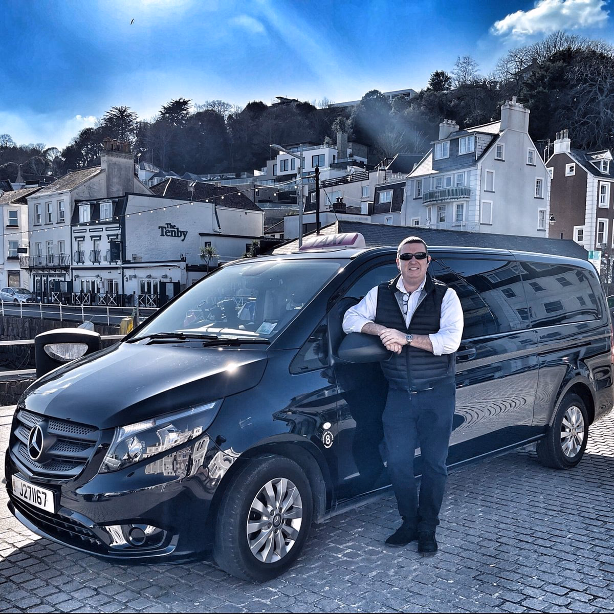 Where can I pick up a cab at Jersey Airport?