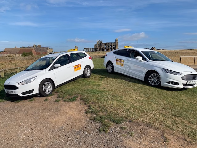 How do I obtain a taxi driver licence in Whitby?