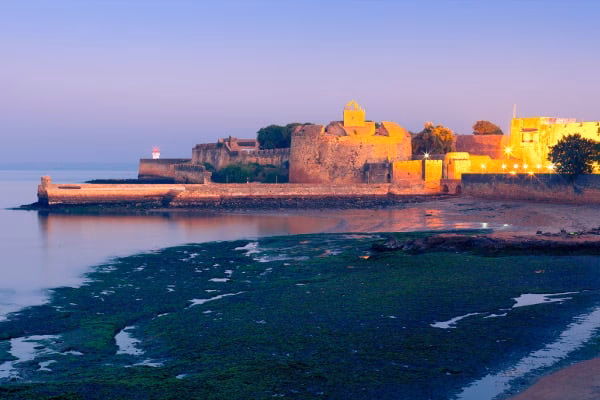 How much does it cost to travel from Ahmedabad to Diu?