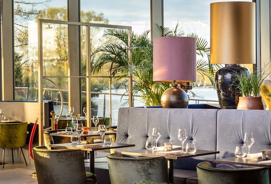 What companies run services between Schiphol Airport and Olympic Hotel?