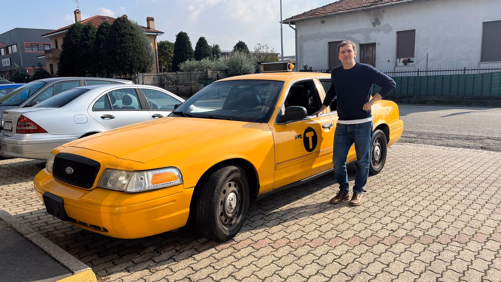 Do I need to call a taxi company in Milan?