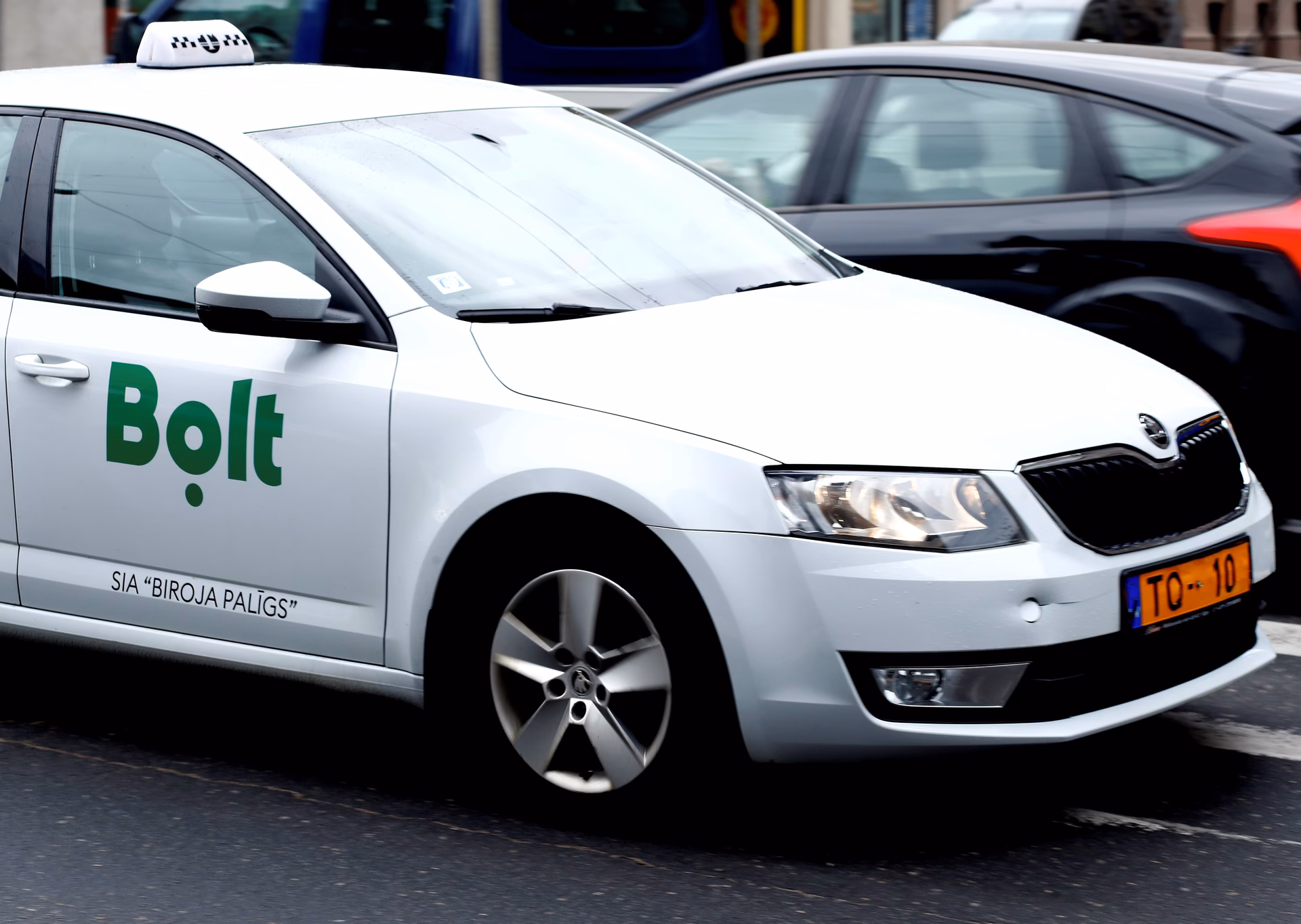 How do I request a ride from Riga Airport?