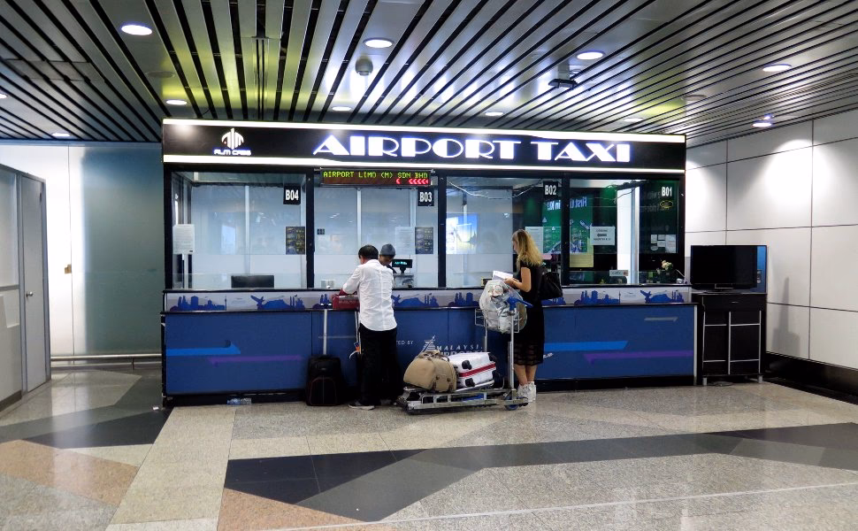 Does Malaysian airport taxi offer transfer services?