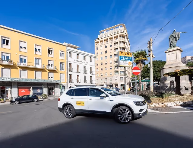 How do I stop a taxi in Cagliari?