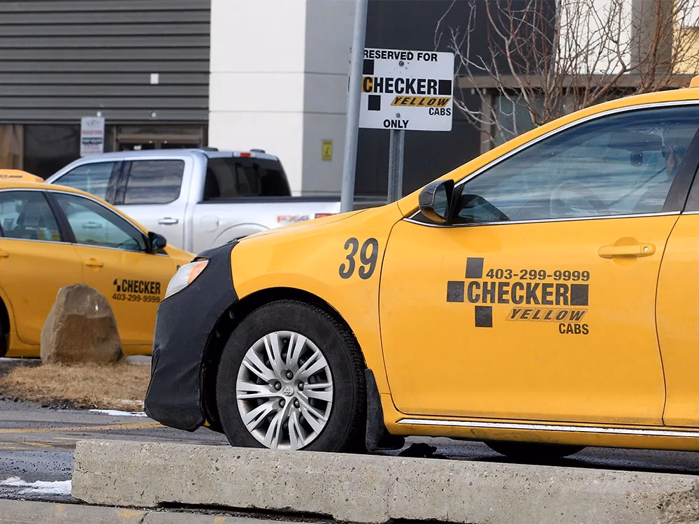 Can a taxi pick up a passenger in Calgary?