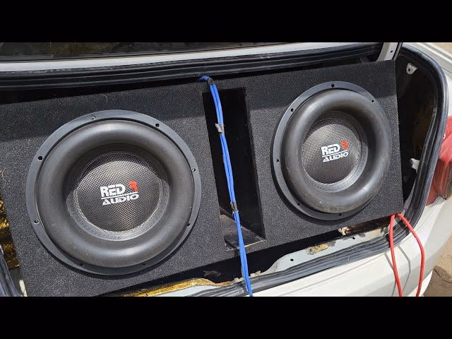 Where should a subwoofer be located in a car?