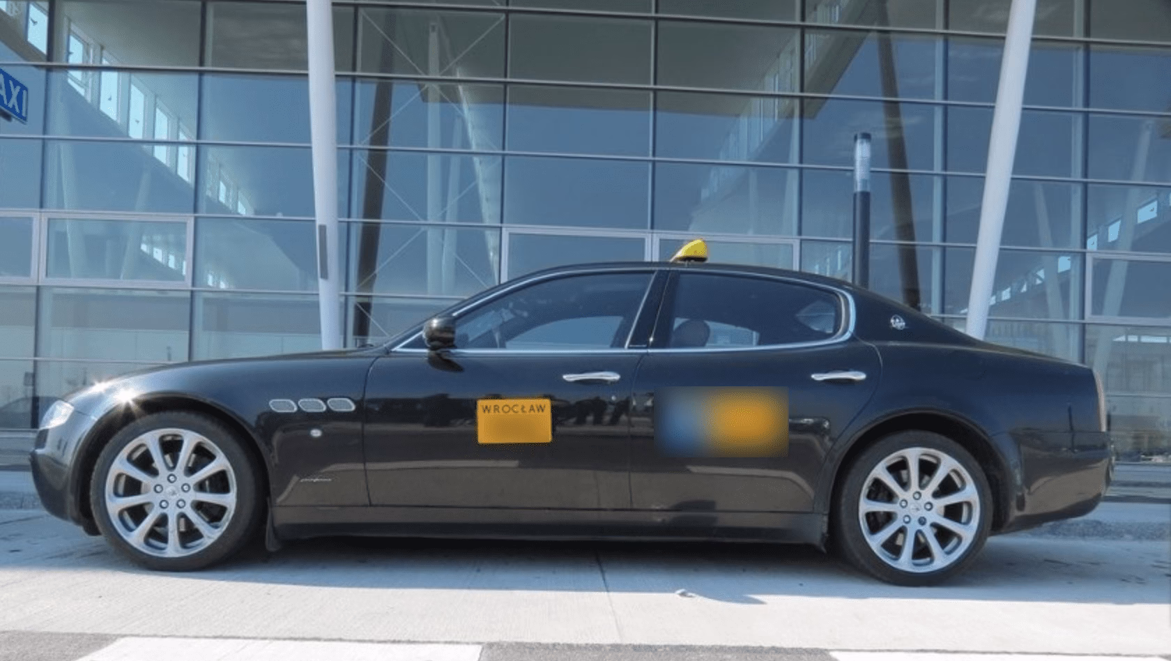 How do I pre-order a taxi or airport shuttle in WROC?