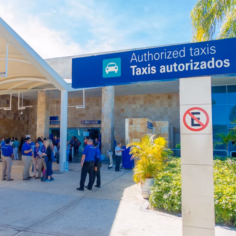 Are there taxi scams running at Cancun International Airport?