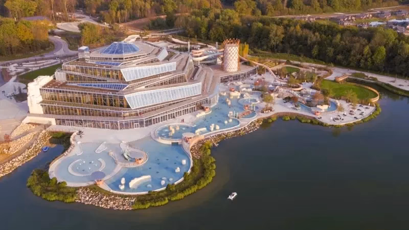 What companies run services between villages nature and Paris Charles de Gaulle Airport?