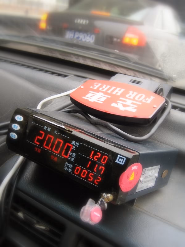 How do I stop a taxi in China?