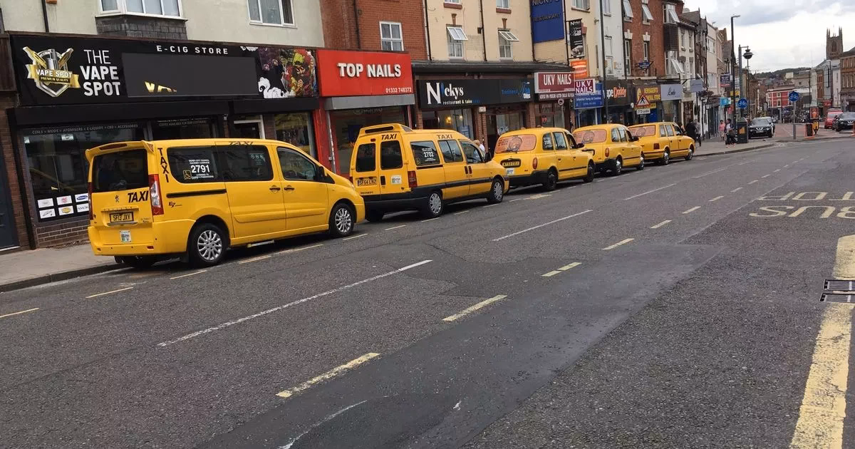 How do I stop a taxi in Derby?