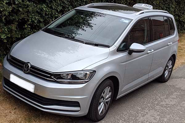 How is the cost of a taxi determined?