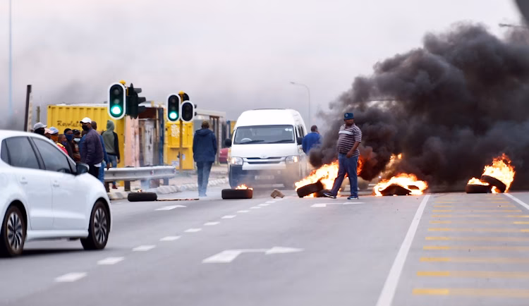 Why did taxi drivers protest in Paris?