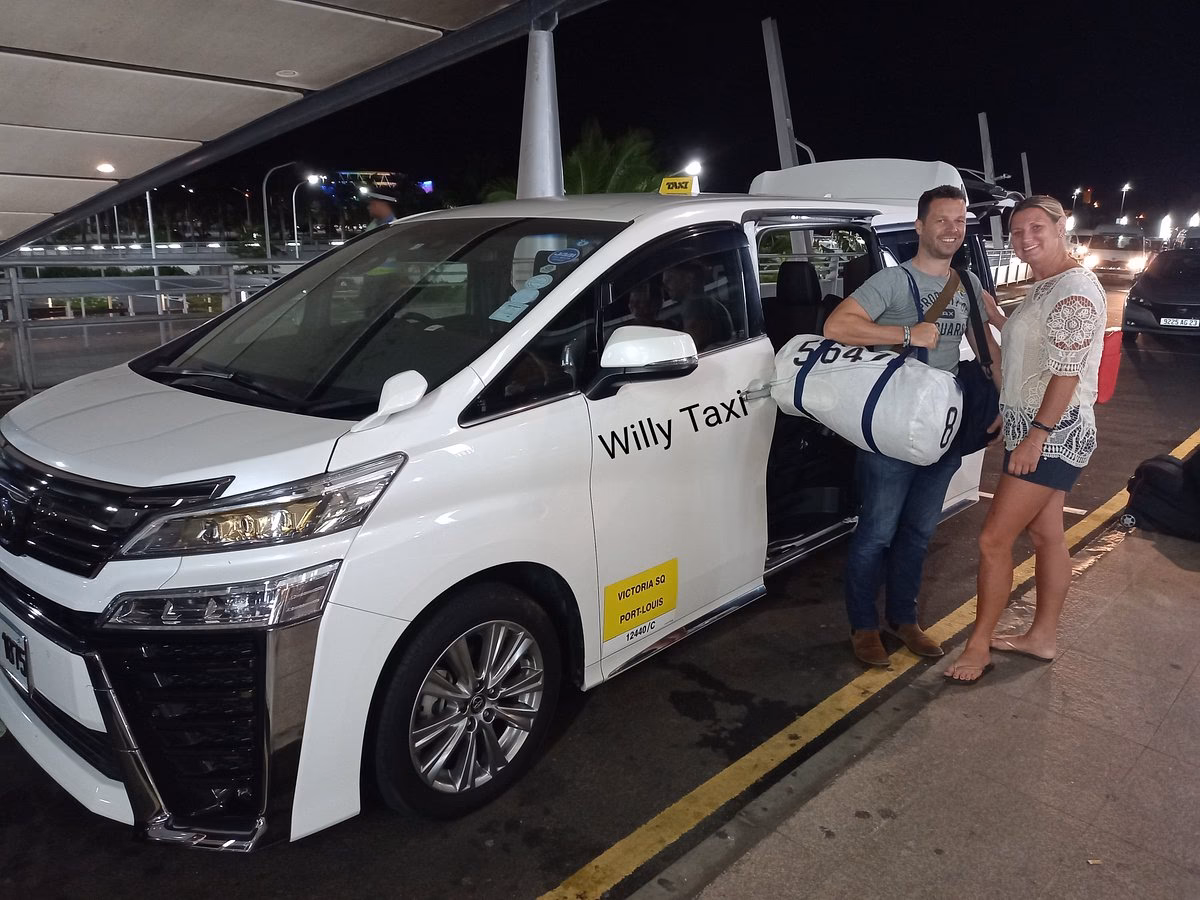 Should I book a taxi from Mauritius Airport to the hotel?