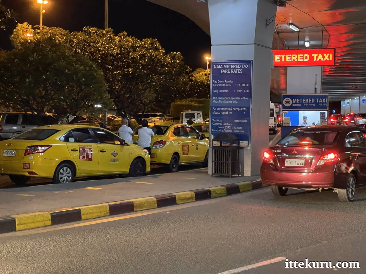 How to ride a yellow taxi at Manila airport?