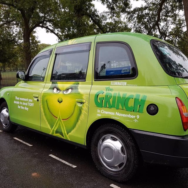 Why do taxi firms use a beige vinyl wrap?