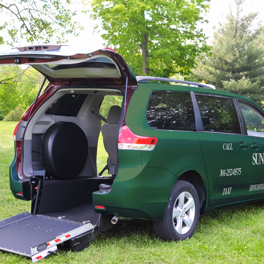 How can wheelchair users access taxis and private hire vehicles?