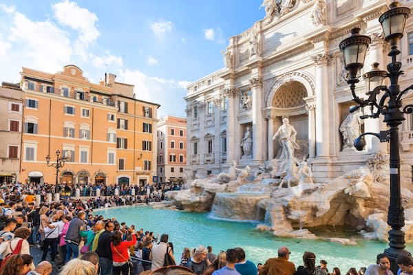 What companies run services between Trevi Fountain & Rome airport (FCO)?