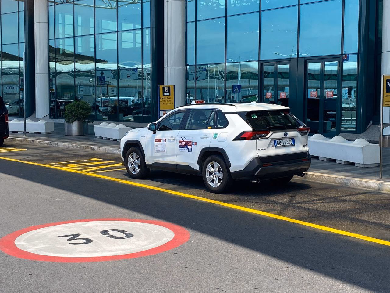 How do I pre-order a taxi or airport shuttle in Rome Fiumicino?