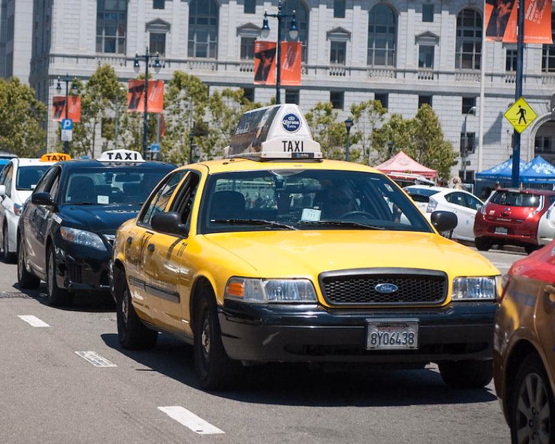 How do I get a ramp taxi from SFMTA?