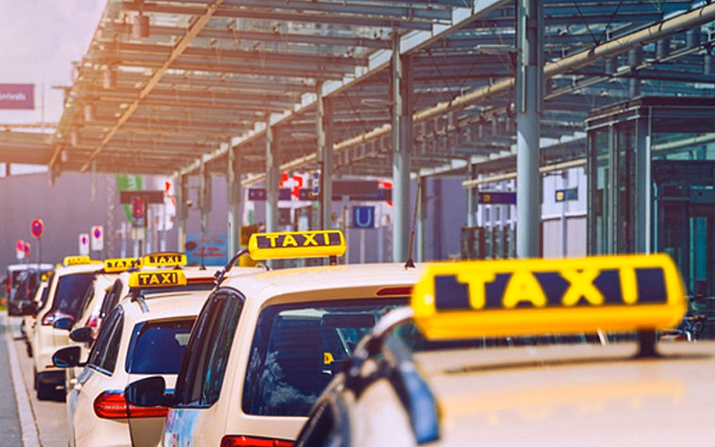 What companies run services between Sharjah and Deira?