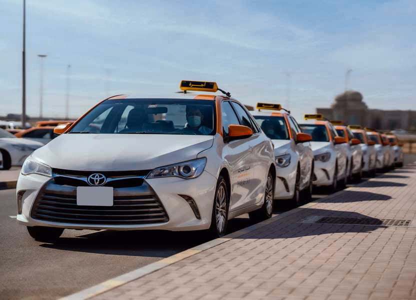Are private taxi services legal in Sharjah?