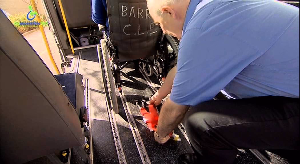 Can a wheelchair user travel in a car?