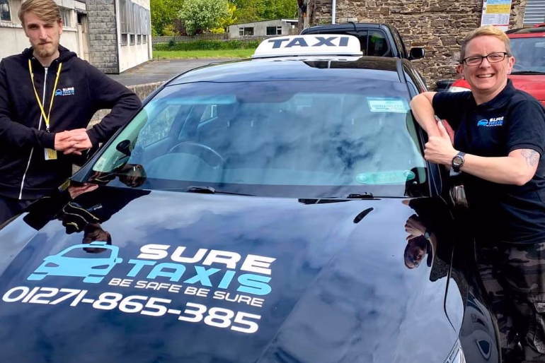 What is the phone number to book a journey with Sure Taxis?