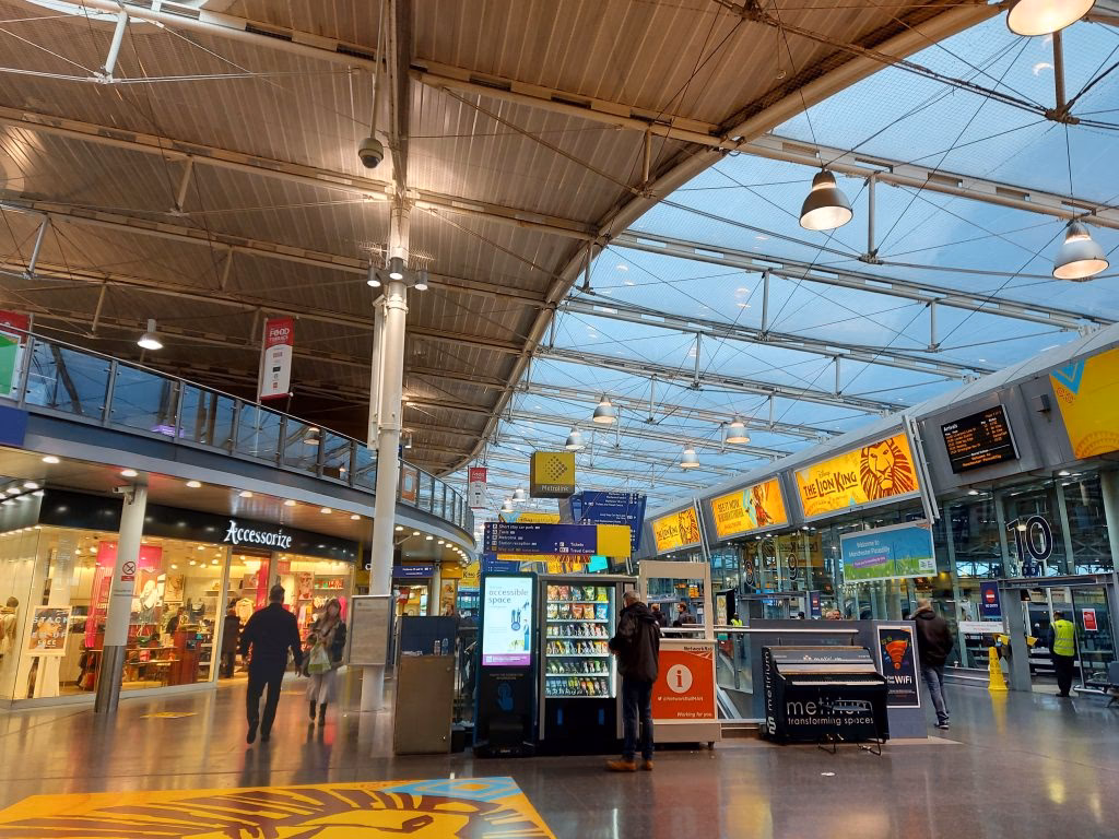 How do I get from Manchester Piccadilly to University shopping centre?