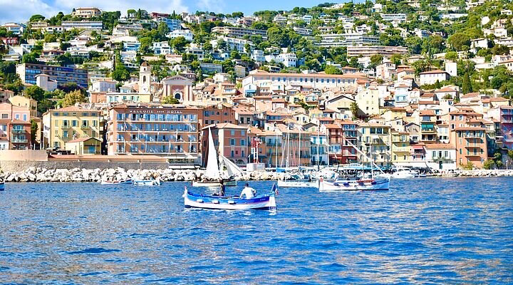 How far is Villefranche from Nice & Monaco?
