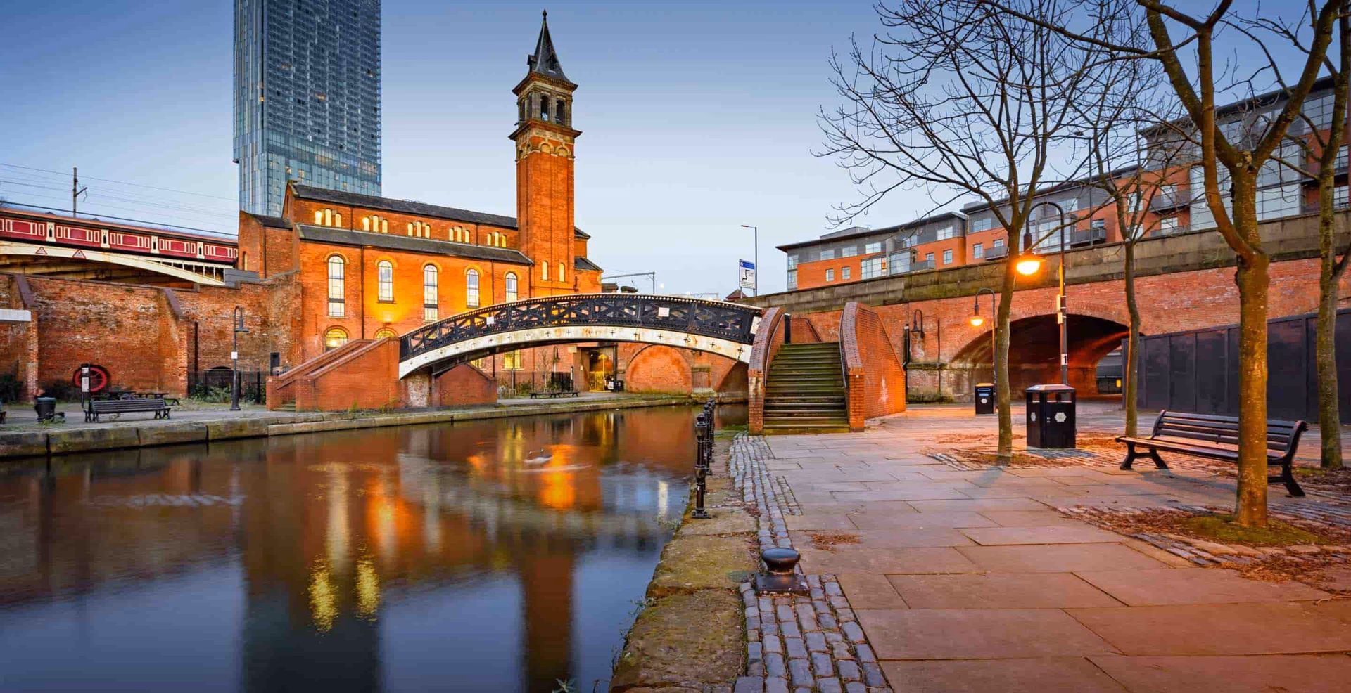 What companies run services between Manchester Airport station and Heald Green?