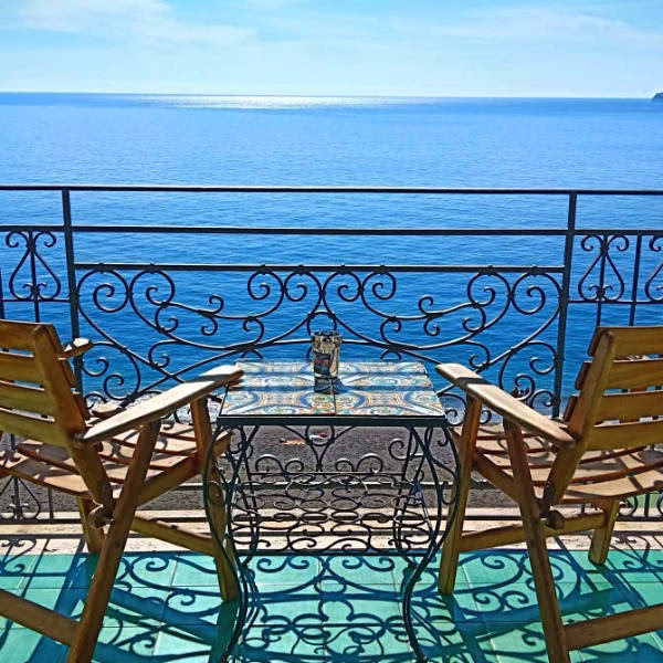 What companies run services between Maiori & Naples Airport (NAP)?