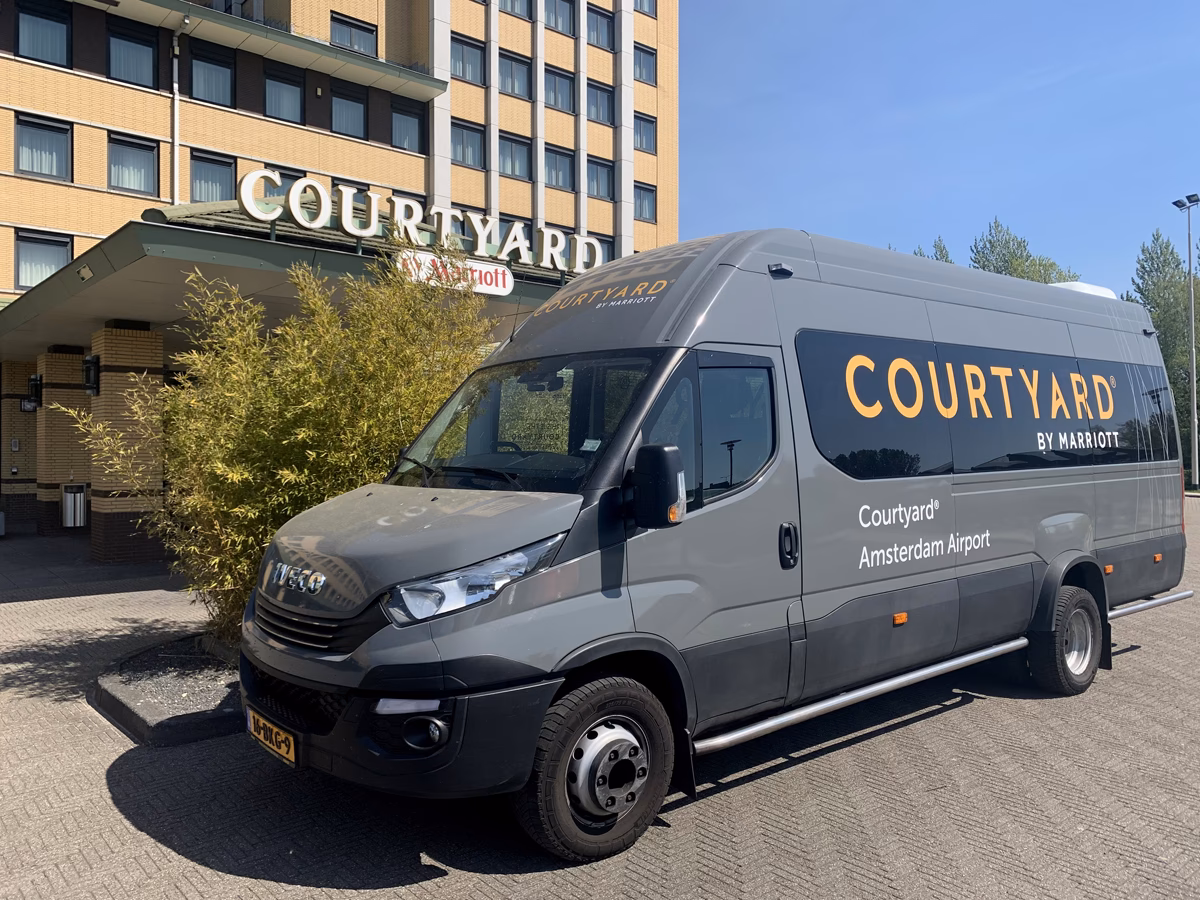 How far is Amsterdam Schiphol Airport (AMS) from Amsterdam Marriott Hotel?