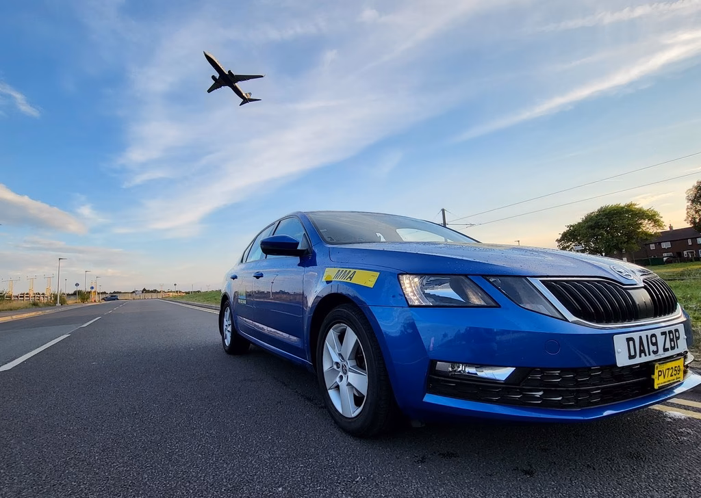 How do I book A minicab from Burnley to Manchester Airport?