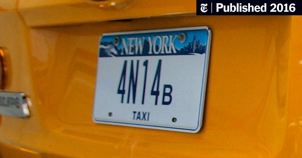 What kind of plate has a yellow taxi on it?