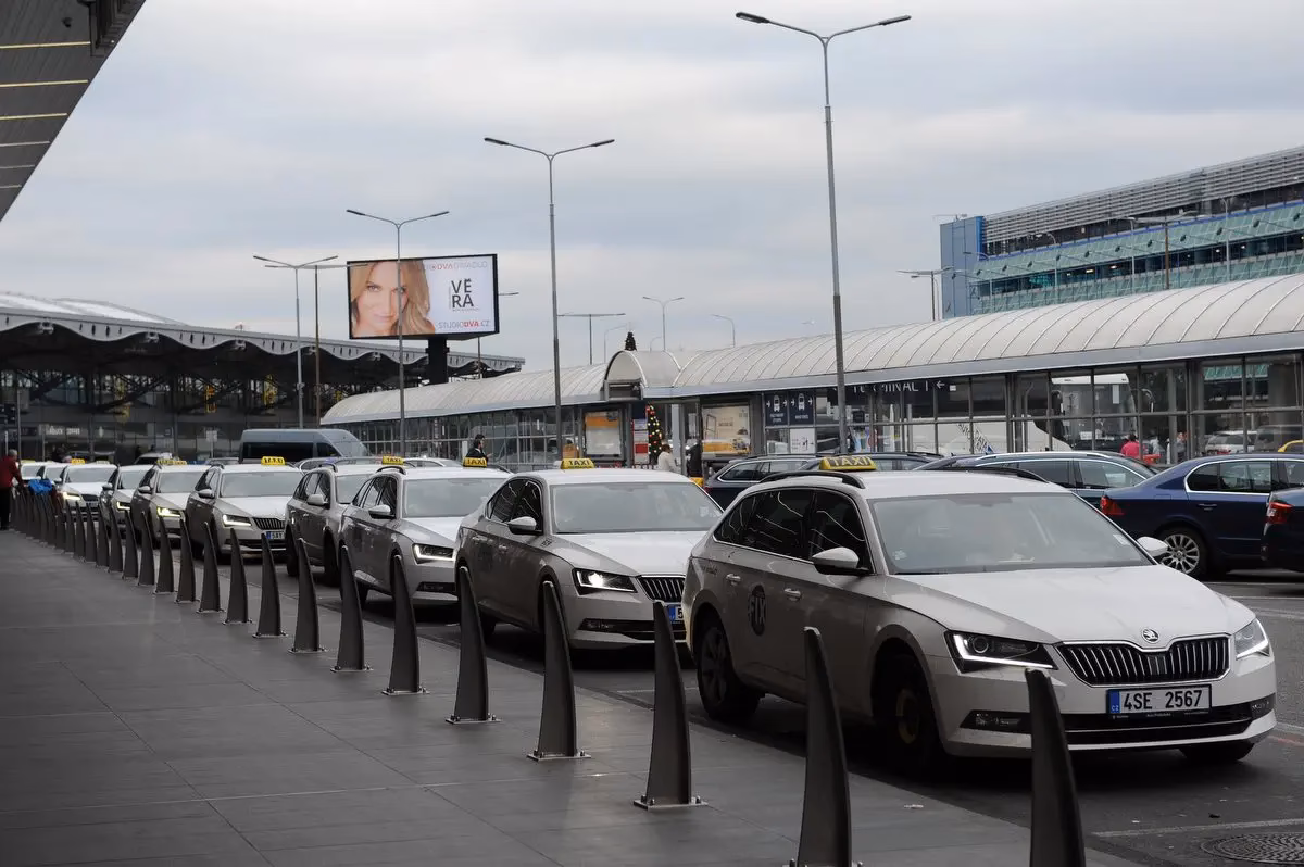 Which company provides official taxi service at Prague Airport?