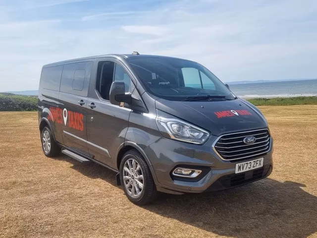 How do I pre-book a taxi from Cardiff Airport to Porthcawl?